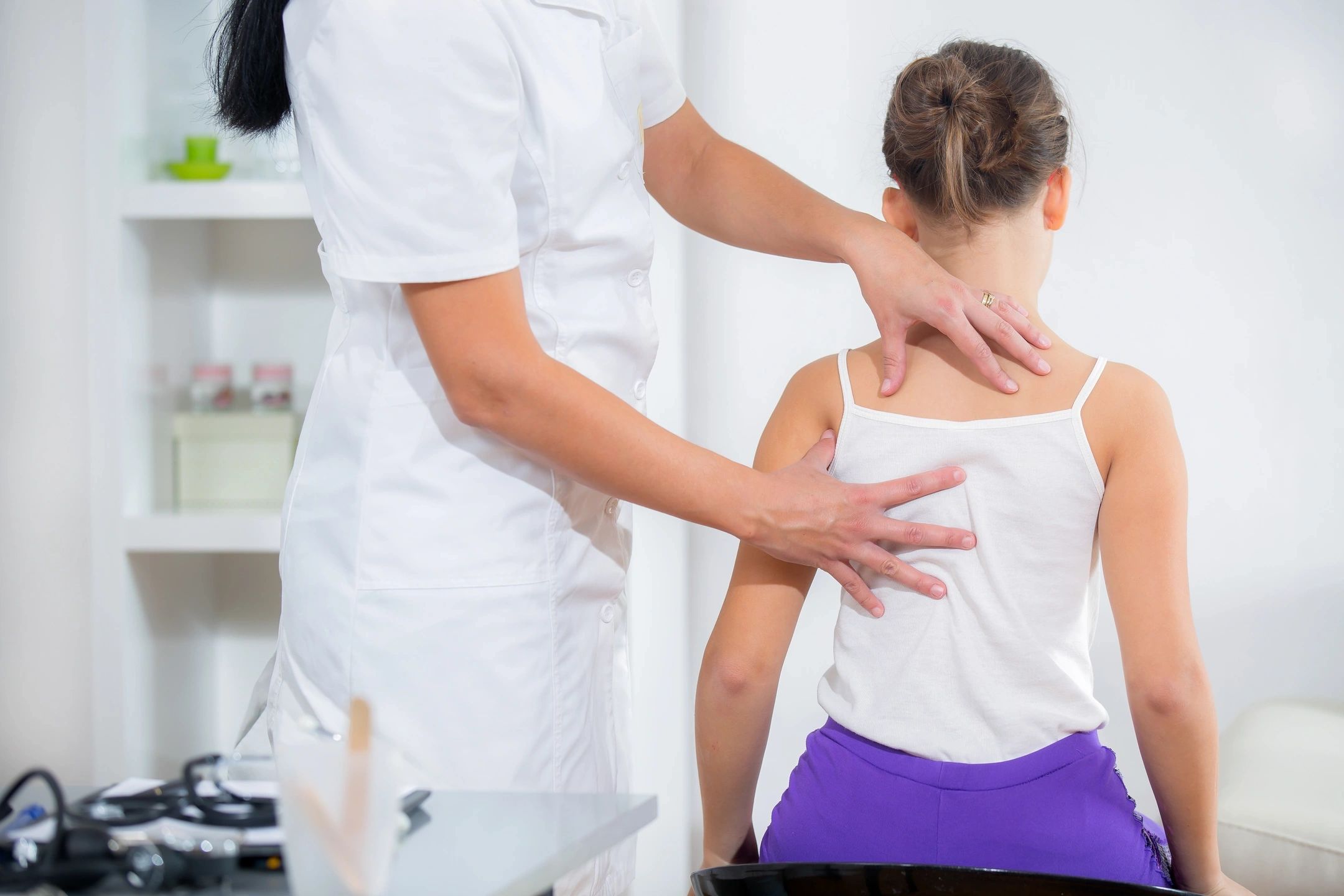 Clinician assessing a patient's posture and shoulder during a Musculoskeletal Health Screening
